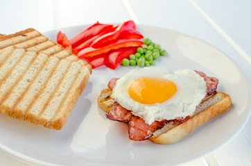 Fresh breakfest - ham, eggs, vegetable and toast