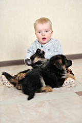 Obraz premium portrait of a little boy with a puppy