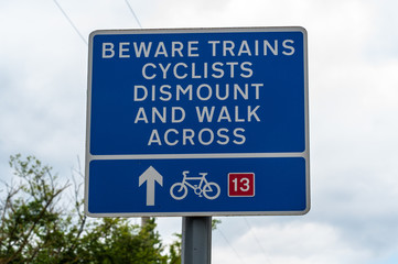 Beware trains cyclists dismount and walk across