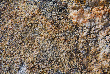 Yellow stone textured granulated background