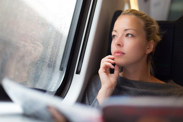 Lady traveling by train.