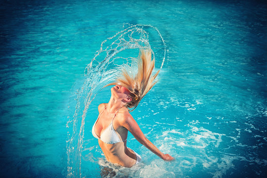 blonde woman at the swimming pool