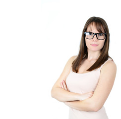 Pretty smiling young woman in black glasses with crossed arms on