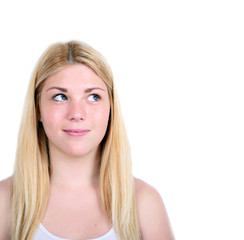 Portrait of beautiful girl thinking and looking up against white