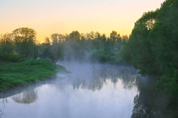 Fototapeta premium landscape with sunrise over the river and fog