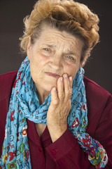 Senior woman having tooth ache - obrazy, fototapety, plakaty