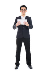 asian businessman using computer tablet full body isolated