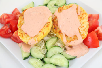 delicious baked potatoes with sauce and vegetables
