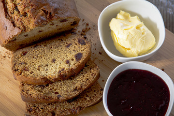 Date Loaf, Jam and Butter on Cutting Board