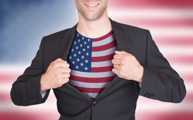 Businessman opening suit to reveal shirt with flag