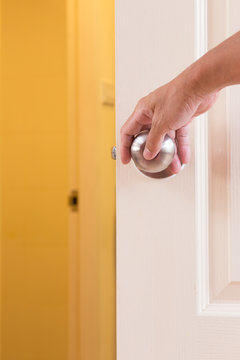 Man Hand Locking Door Knob