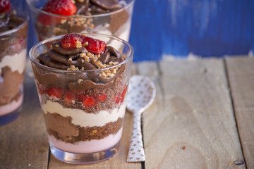 Chocolate cake dessert, yogurt and strawberries