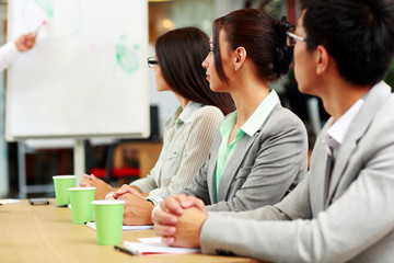 Business people sitting around a table during a meeting 