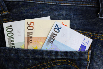 Euro banknotes in jeans pocket