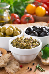 antipasti - pesto, olives, fresh vegetables and bread