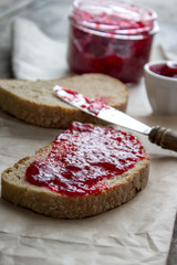 Slices of bread and raspberry jam