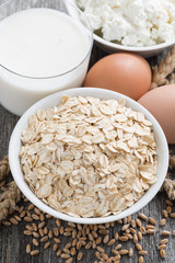 fresh products - oatmeal, eggs, cottage cheese and milk, closeup
