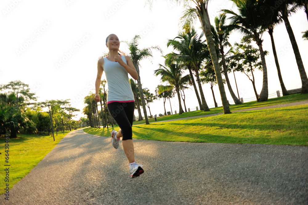 Poster woman runner athlete running at tropical park