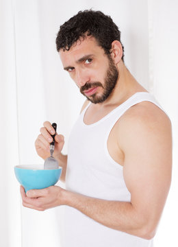 man eating cereal