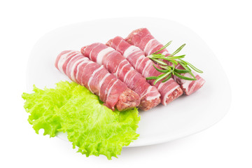 Rolls of bacon and minced