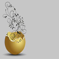 gold ornamental flowers emerging from broken egg shells.