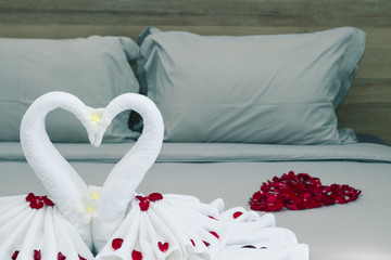 Vintage bedroom interior design with swans from the towel decora