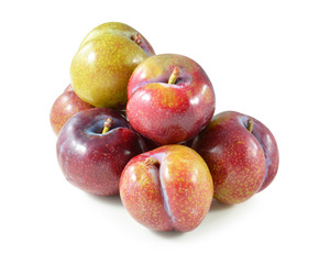 plums isolated on white