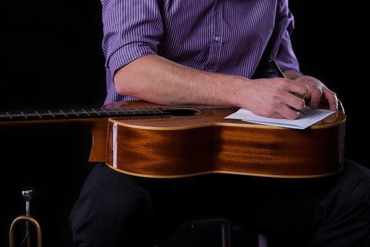 Guitarist Writing A Song