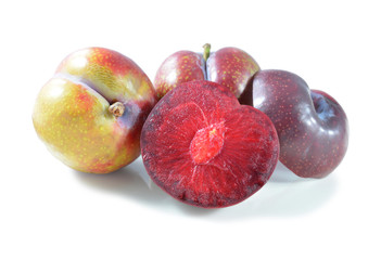 plums isolated on white