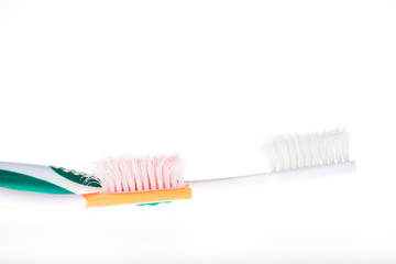 Two Color worn toothbrush on isolated white background