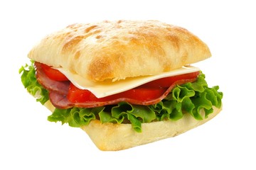 Isolated ciabatta sandwich with ham, tomato, lettuce and cheese