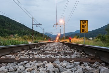 Fototapeta na wymiar Railroad tracks passing a sign