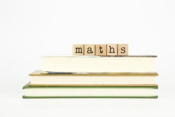 maths word on wood stamps and books