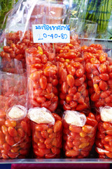close up small tomato in plastic bag