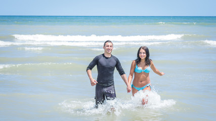 couple running in the water