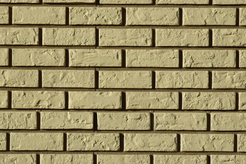 Fototapeta premium Wall made of decorative grey bricks with dark seams