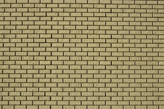 Fototapeta Wall made of decorative grey bricks with dark seams