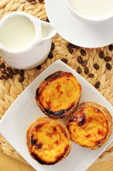 milk and pasteis de nata, typical Portuguese egg tart pastries