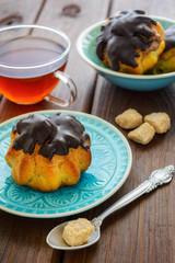 Eclairs and cup of tea