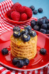 Fresh raspberries and blueberries on the cookies
