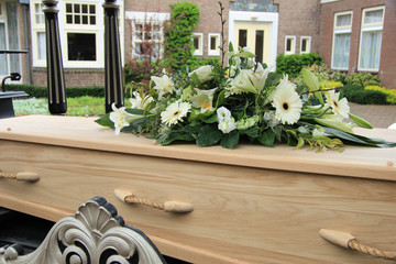 Funeral flowers on a casket
