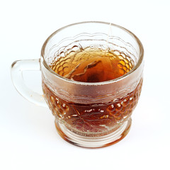 Glass cup of hot tea