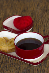 Morning coffee with bread on the wooden table