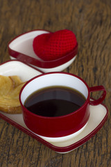 Morning coffee with bread on the wooden table