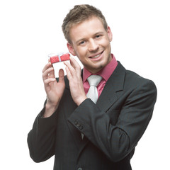 businessman holding small red gift