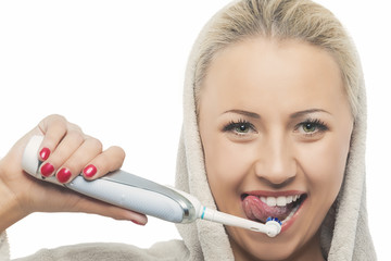 Portrait of Caucasian Blond Woman in Bathrobe Cleaning Teeth wit