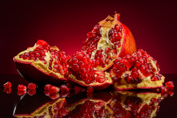 pomegranate fruits on a red background