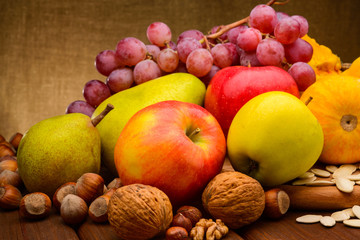 Naklejka na ściany i meble colorful assorted of fruits on fabric background