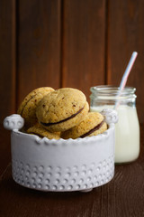 cookies and glass milk on wood table
