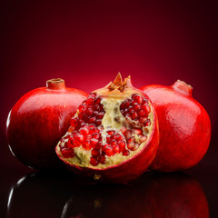 pomegranate fruits on a dark background